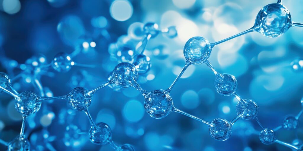 Abstract depiction of a molecular structure with interconnected translucent blue spheres representing atoms, linked by thin bonds against a glowing blue background.